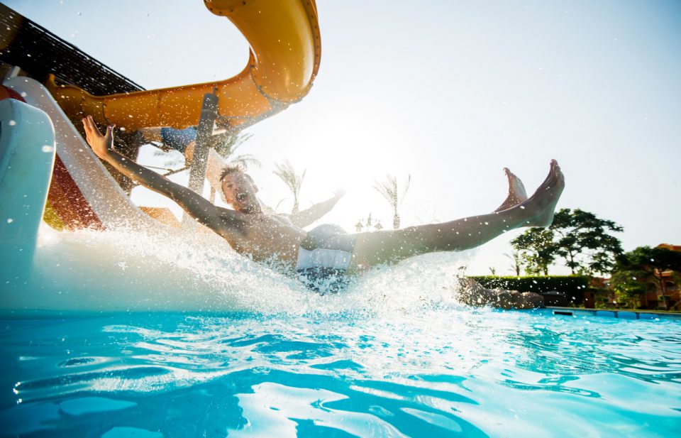 Man having fun on water slide at Hurricane Alley Waterpark