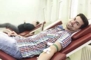 Man giving blood for World Blood Donor Day